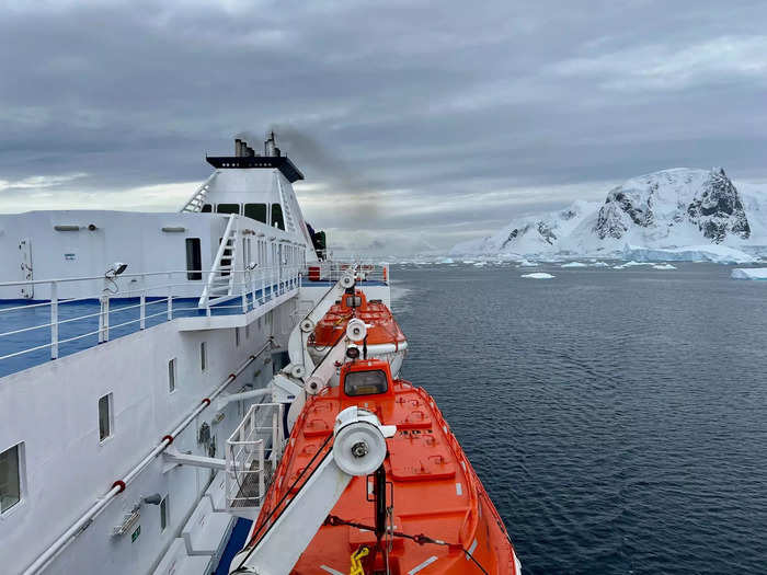 The ship had plenty of standing areas outside, both in the front and back of the boat, as well as along the side.