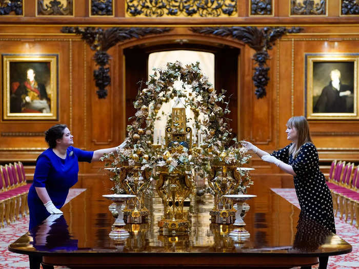 At Windsor, festive items and art from the Royal Collection Art adorn the Waterloo Chamber.