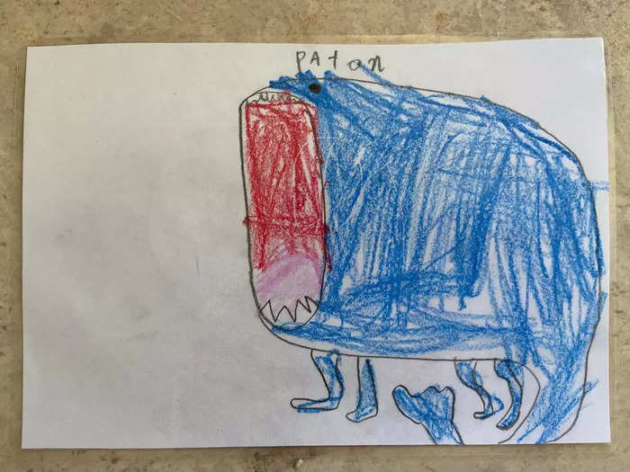 A drawing of a monster and the monster made into a toy that looks exactly like it