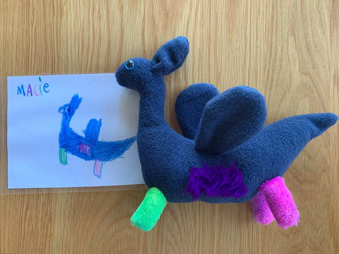 A drawing of a monster and the monster made into a toy that looks exactly like it