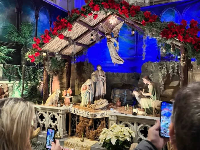 But I was taken aback by just how many people were filing into the church to see its decorations and nativity scene. Every way I turned, I watched people snap picture after picture.