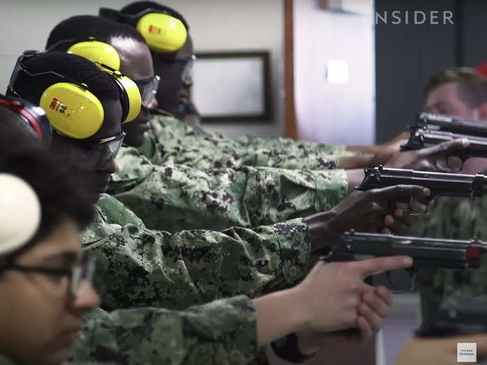 Navy: Recruits work on their marksmanship during basic training, learning how to safely fire a pistol — as well as assemble and disassemble the weapon.