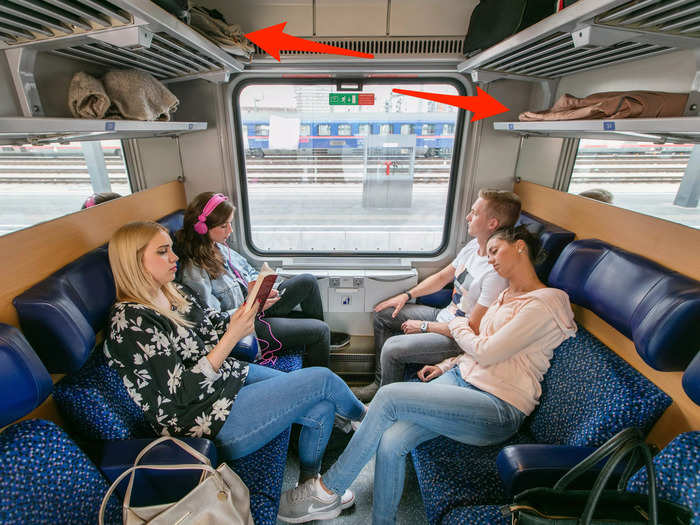 Right away, I thought the room was cramped and lacked enough legroom for each traveler. But I was surprised to find ample luggage space on two rows of storage racks above the seats.