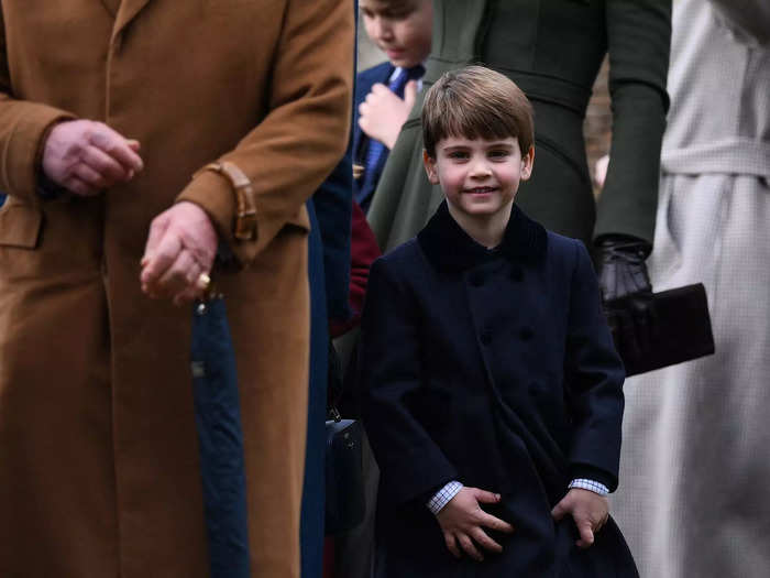 Louis smiled as he walked beside his grandfather, King Charles III.