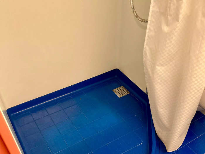 Even with three kids sharing one small bathroom, the floor stayed dry thanks to the shower