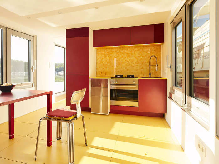 Its kitchen features a pop-up dining table. There