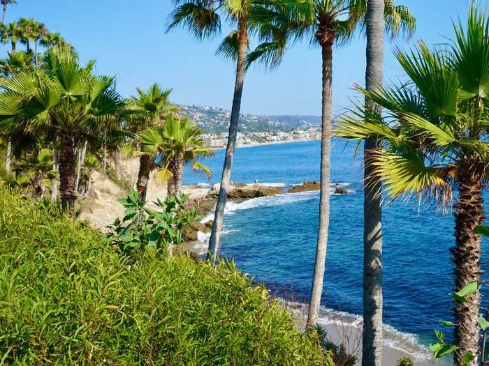 Appreciate the art and green spaces in Laguna Beach.