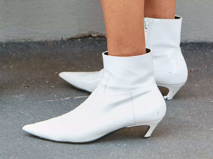 Short, curved-heel ankle boots add a modern touch to the traditional look.