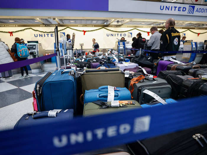 Piles of dropped luggage were left at United Airlines