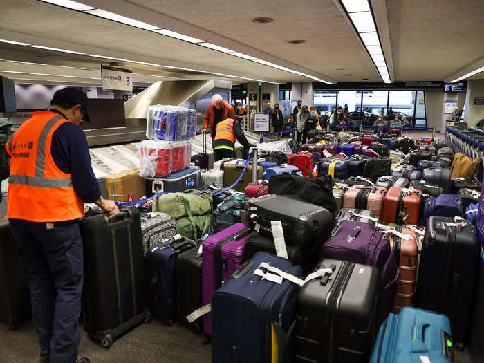 A sea of suitcases was also seen around the carousels at San Francisco International Airport after airlines canceled thousands of flights.