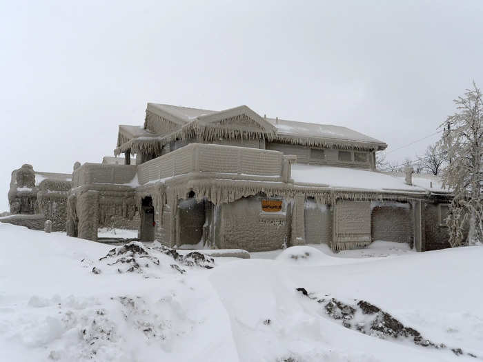 A large house on Hoover Beach in Hamburg, New York, looks like an ice castle after facing waves and spray from Lake Erie combined with freezing temperatures.