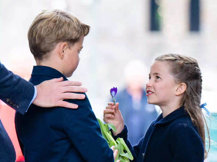 Hussein snapped this photo of Princess Charlotte, 7, showing her brother Prince George, 9, a flower during a visit to Wales.