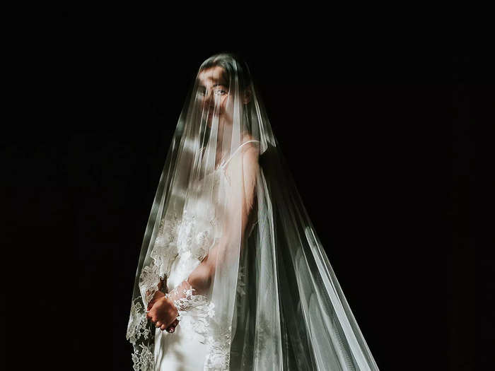 Nor can a dramatic photo of a bride in her dress and veil.