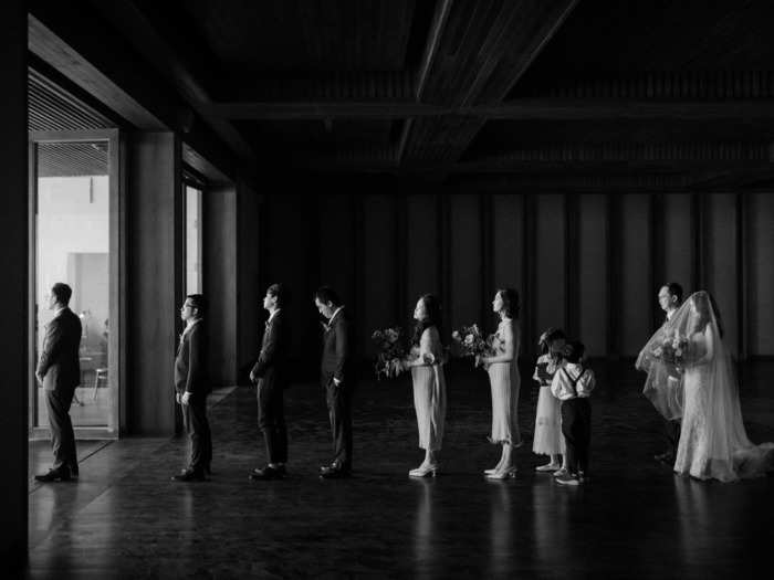 This photographer snagged a photo of the whole wedding party, just before they began their walk down the aisle.