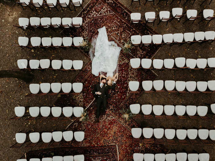 An aerial shot centers the newlywed couple in the middle of the aisle.