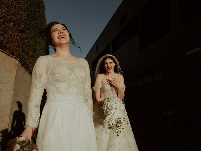 Two brides radiate joy, and they were perfectly captured in this photo.