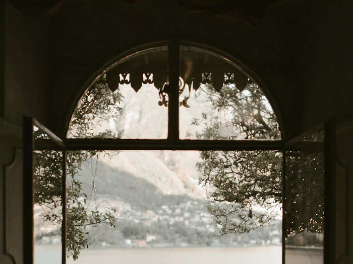 A couple shares an intimate moment during their wedding at Lake Como in this photo.