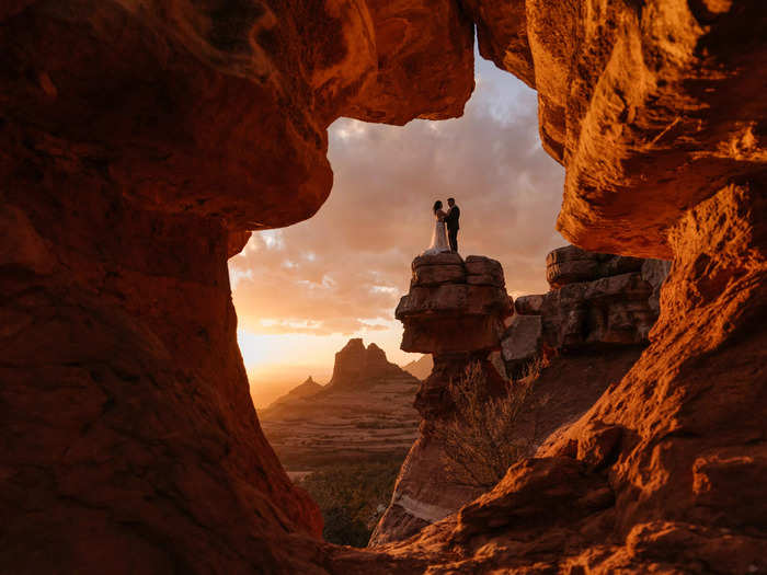 An Arizona canyon perfectly framed this bride and groom at sunset.