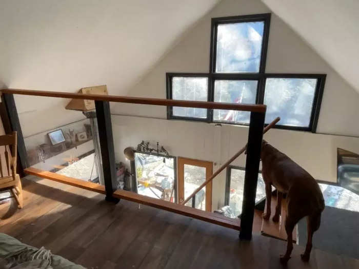 Since most of the house is in one room, Allie and Dillon created space by putting their bedroom in a loft.