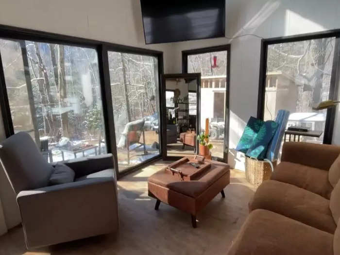 Their living room has glass doors that allow natural light inside.