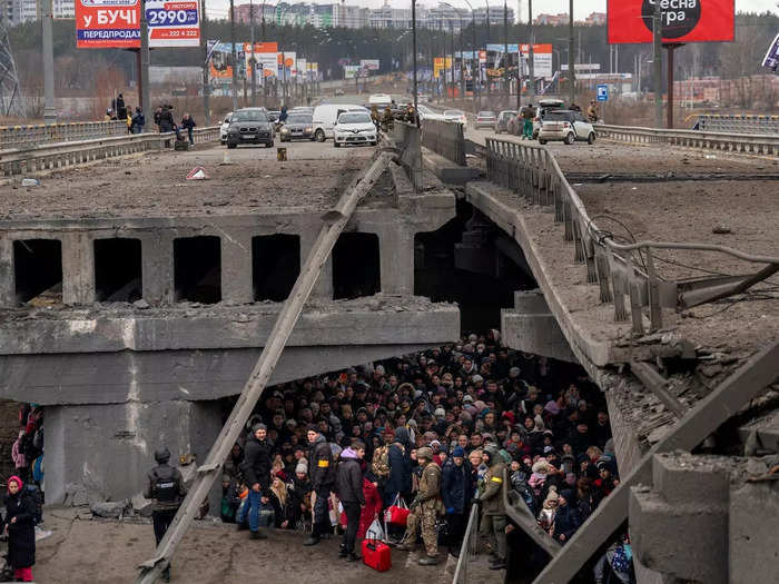 Tides of people pushed to evacuate as Russian forces blasted the smaller cities surrounding Kyiv, prompting scenes like this in Irpin.