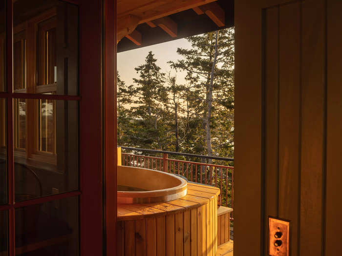 A hot tub sits inside an east-facing alcove on the outdoor deck where guests can watch the sun and moon rise.