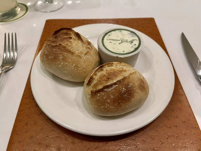 The server gave us bread rolls with herb-garlic butter that was marked with Lahaina Grill