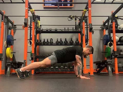 Jake Harcoff demonstrates a standard push-up, one of the best push-ups for improving strength