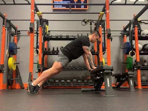 Jake Harcoff demonstrates a box push-up, one of the best push-ups for improving strength