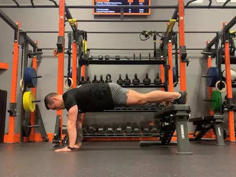 Jake Harcoff demonstrates a decline push-up, one of the best push-ups for improving strength