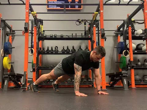 Jake Harcoff demonstrates a clapping push-up, one of the best push-ups for improving strength