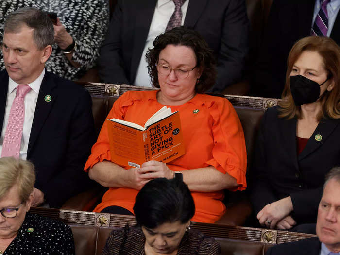 US Representative-elect Katie Porter turns to reading "The Subtle Art of Not Giving a F*ck" by Mark Manson during the 14th speaker vote.