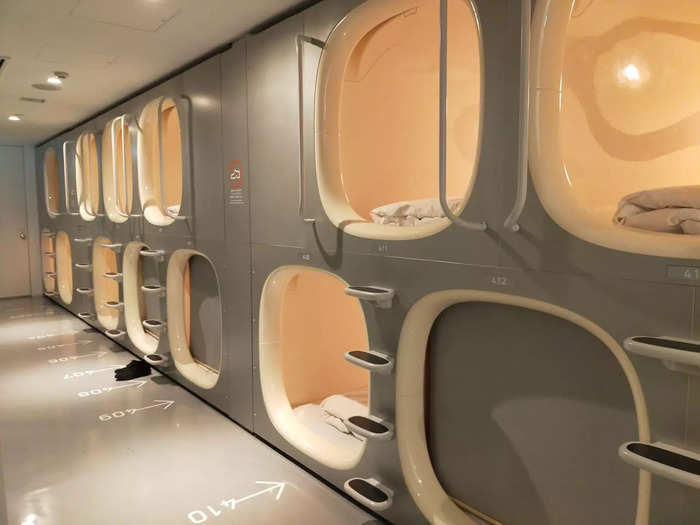 The sleeping capsules are fitted into the walls along the L-shaped corridors.