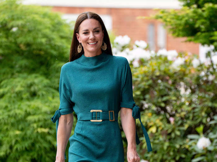 Kate arrived at an event hosted by the British Fashion Council wearing a green belted dress with bow-accented sleeves.