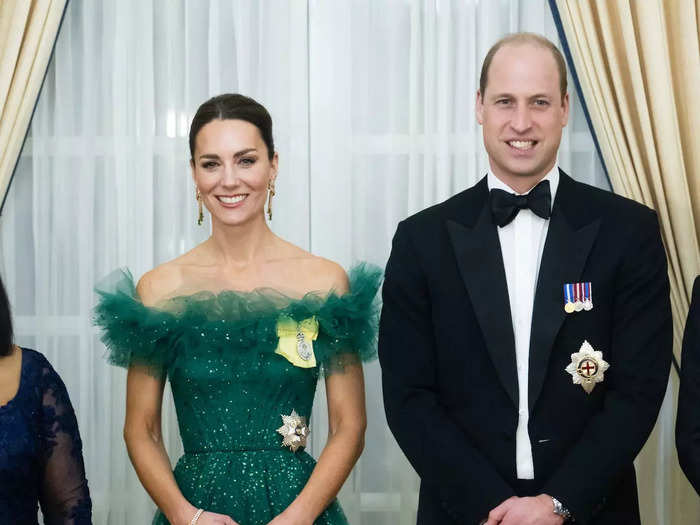 Kate attended an event in Jamaica wearing an emerald off-the-shoulder gown with tulle detailing that paid homage to the colors of the Jamaican flag.