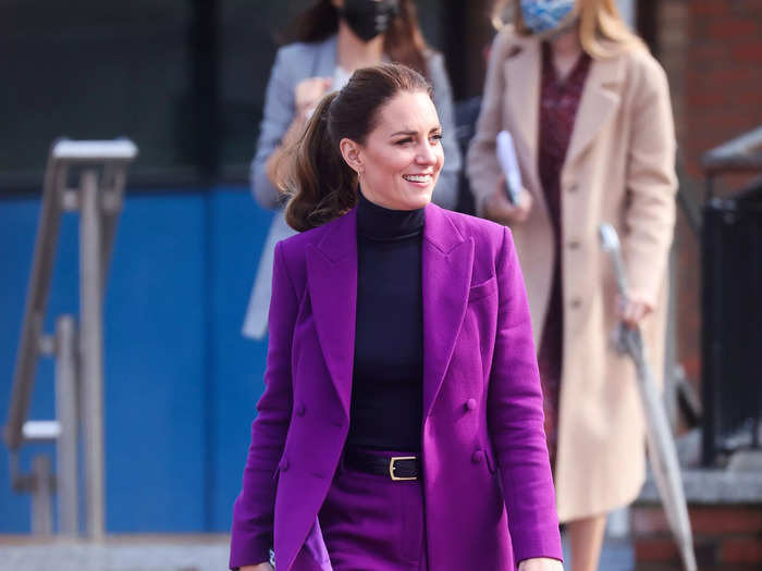 While on an official engagement with Prince William in Northern Ireland, Kate Middleton wore a monochromatic purple suit.