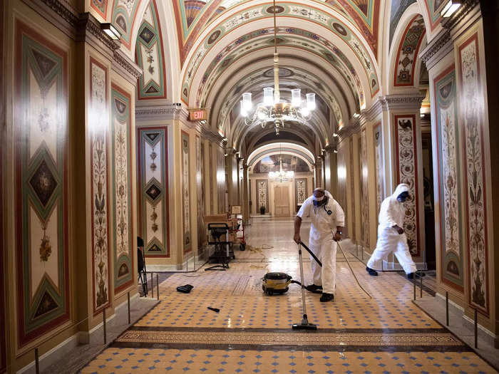 Workers also cleaned up damage in overrun areas of the US Capitol on January 6, 2021.