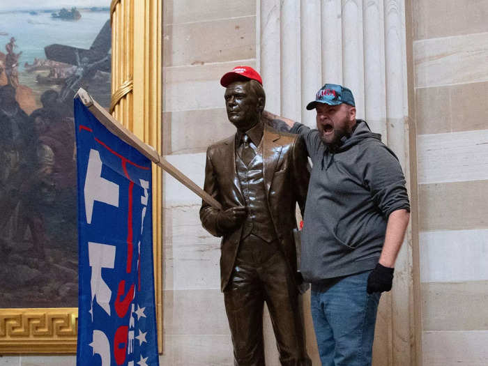 Inside the Capitol building, Trump supporters were also seen placing MAGA caps and flags on the statues of former presidents.