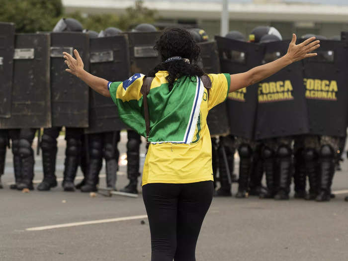 Protesters in Brazil confronted law enforcement in riot gear.