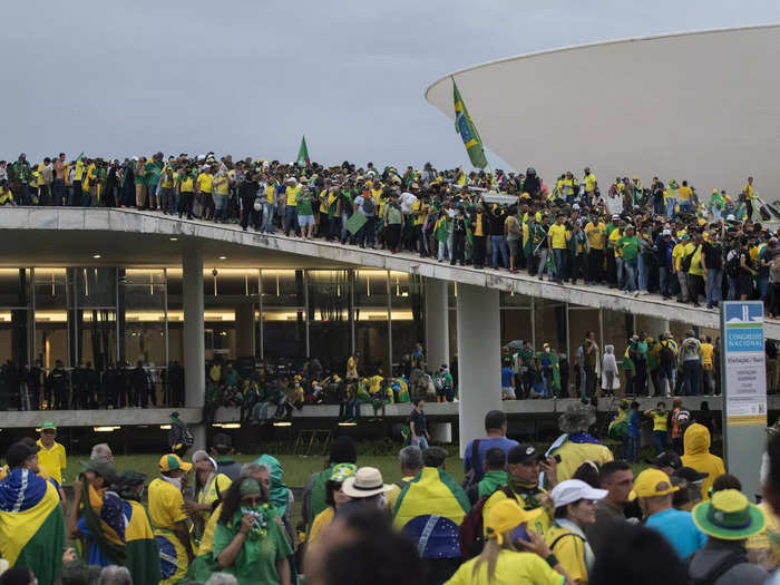 Demonstrators climbed the roofs of government buildings in the country