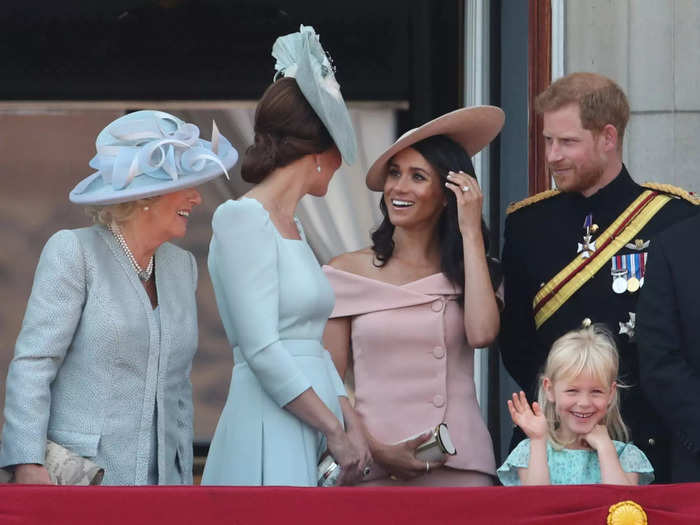 A month after the royal nuptials, Kate and Meghan attended a Trooping the Colour event at Buckingham Palace. The pair spoke animatedly with each other.