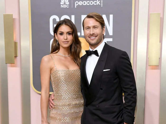 Glen Powell walked the red carpet in a sharp black tuxedo, while his girlfriend, Gigi Paris, chose a gown with an avant garde skirt.