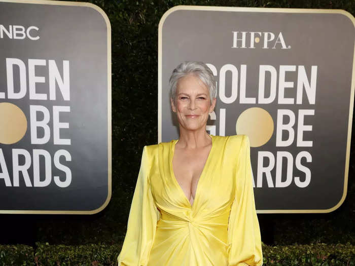 February 2021: Jamie Lee Curtis wore a yellow gown from Alex Perry with a wrapped bodice and deep neckline.