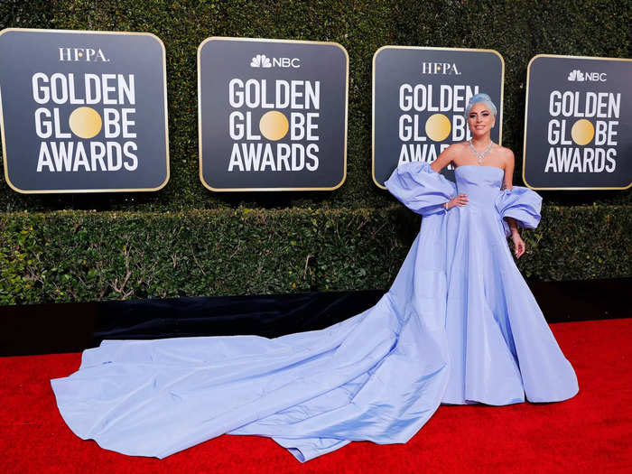 January 2019: Lady Gaga arrived in a powder-blue Valentino gown paired with a statement diamond necklace and blue hair.