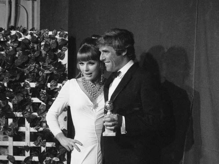 February 1970: Elke Sommer rocked a daring dress that featured a thigh-high slit and feathered skirt.