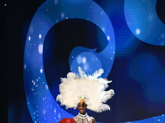 Miss Nigeria donned a bird-inspired headpiece and a masquerade-themed outfit.