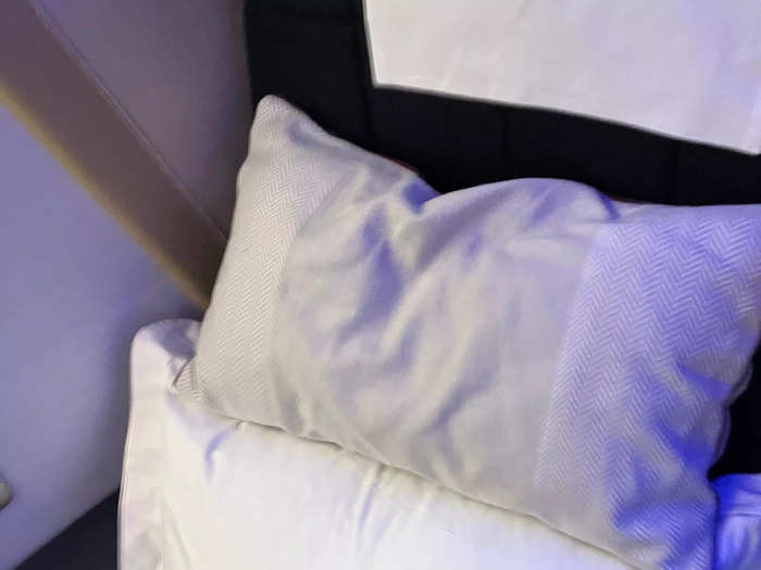 The seat had two pillows, one throw-sized and one full bed-sized pillow. Both were very soft and comfortable.