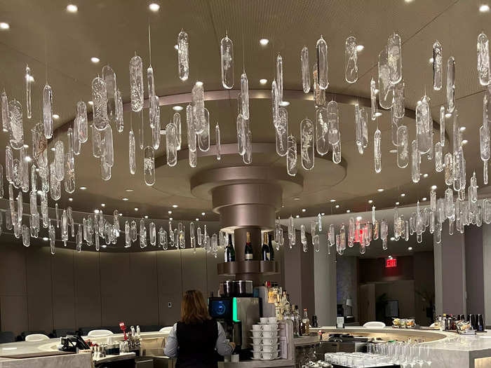 The crystal chandelier framing the bar added to the opulence of this exclusive space.