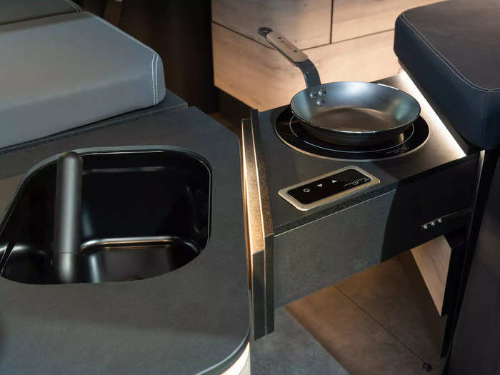 Besides beds, the concept EQT Marco Polo also manages to squeeze in a small kitchenette with a sink, refrigerator, induction cooktop, and storage.