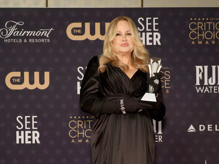 Jennifer Coolidge, who won Best Supporting Actress for her role in "The White Lotus," wore a floor-length black gown with matching gloves.